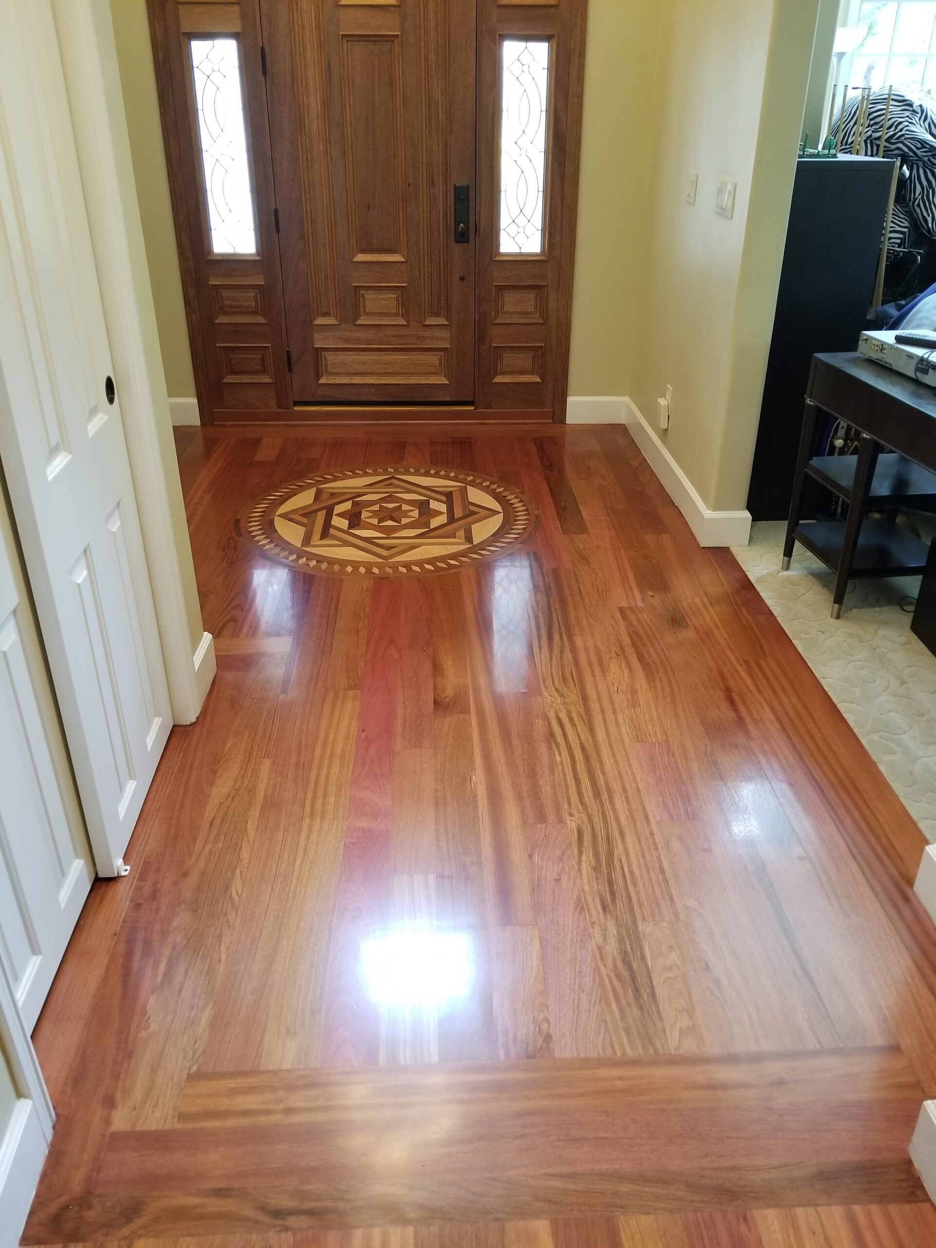 Brazilian cherry wood flooring adds beauty to the entryway ad value to this Palo Alto residence.