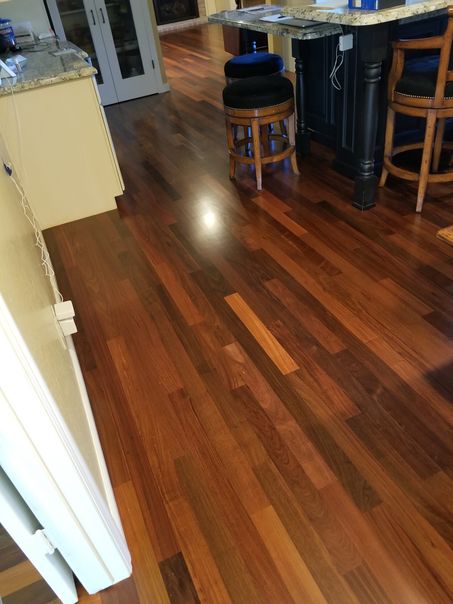 Los Altos residential — kitchen, dinette, family room; refinish Brazilian walnut with three coats of a semi-gloss water-base finish.  750 sq ft refinish.  