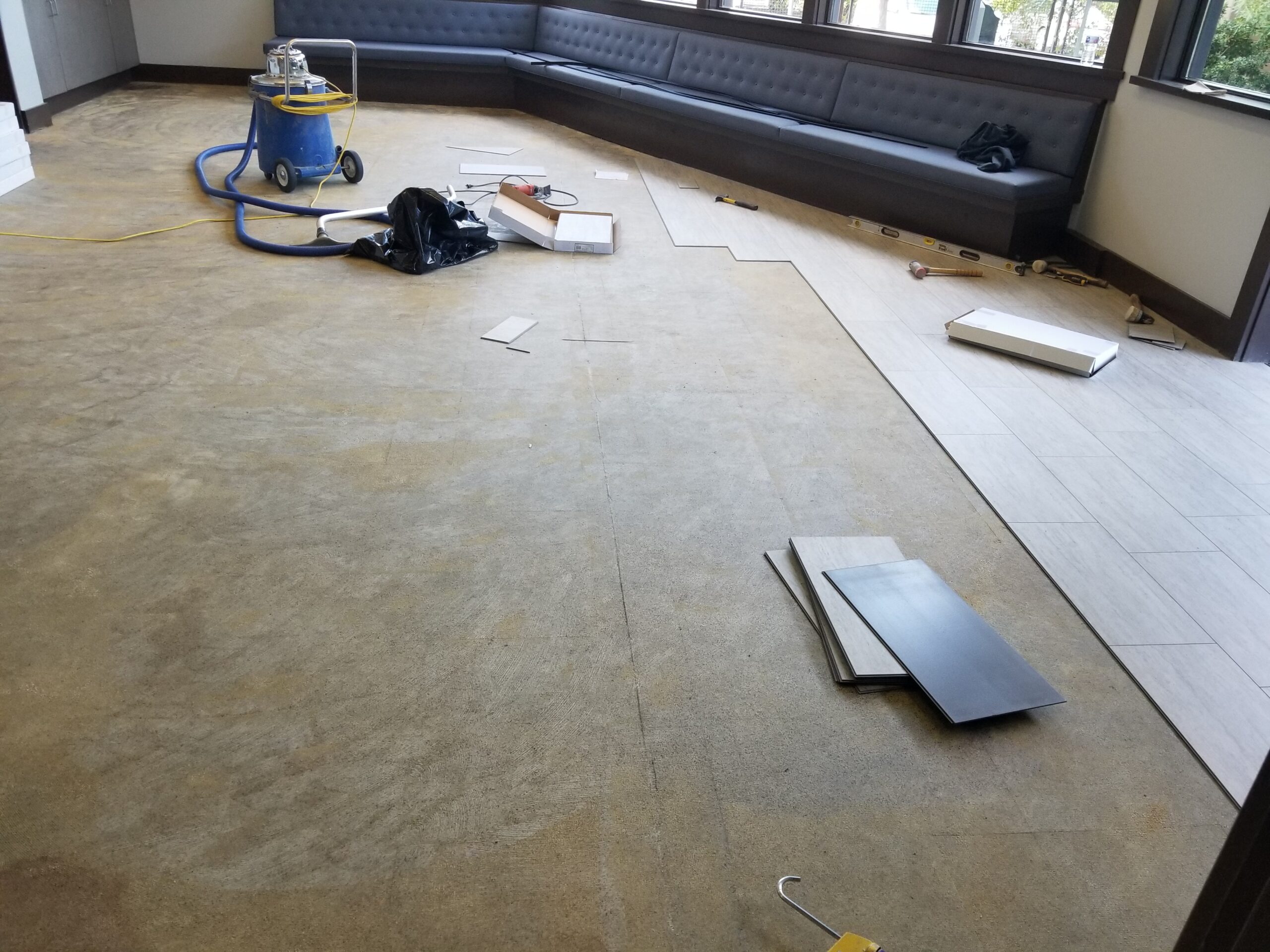 Palo Alto private club's cafe to get LVT after pulling worn carpeting.