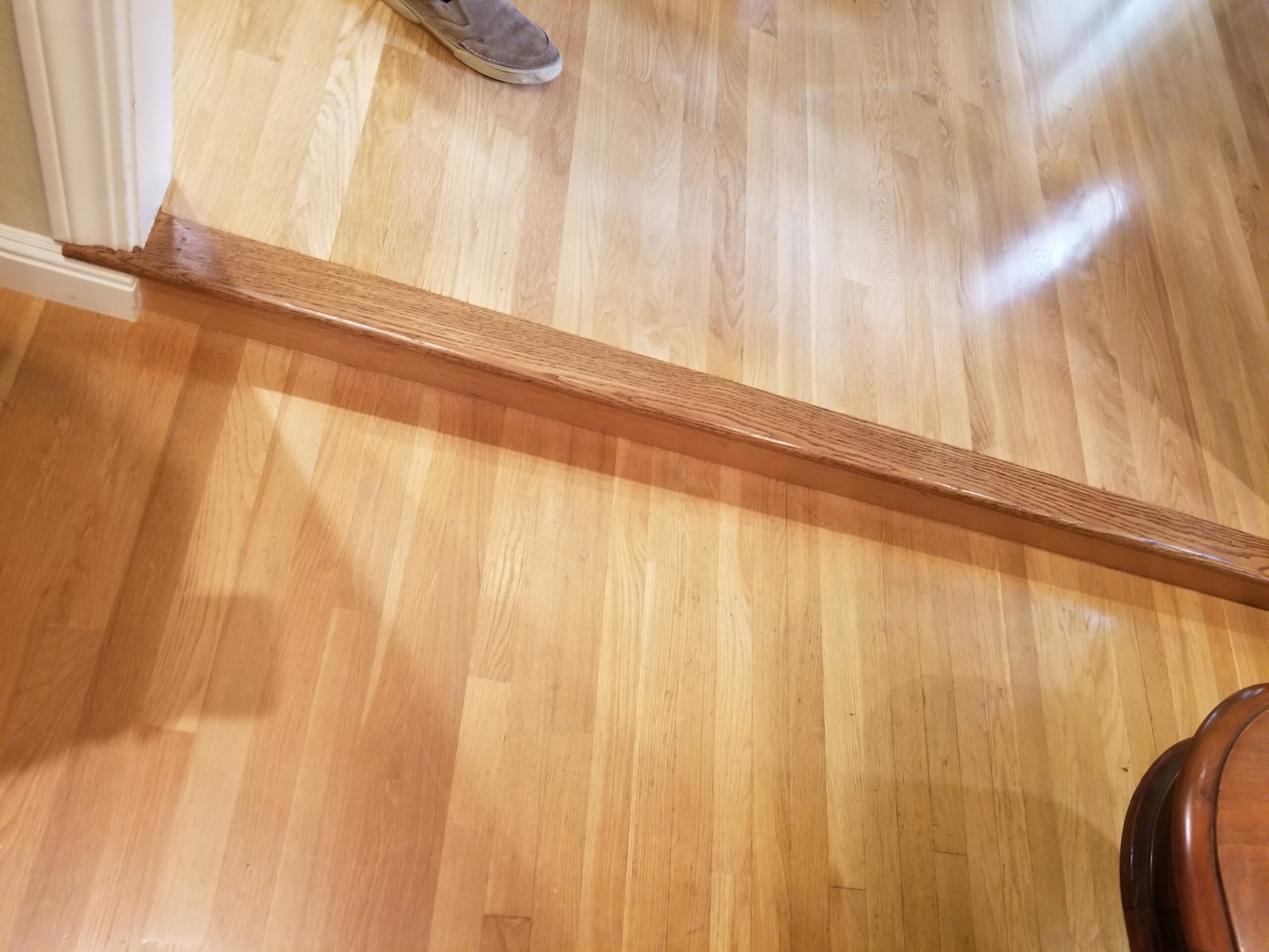 View One: Refinish of 3/4 “x 3 ¼” Red Oak floors with 3 coats of gloss water-base finish.  Job also included 