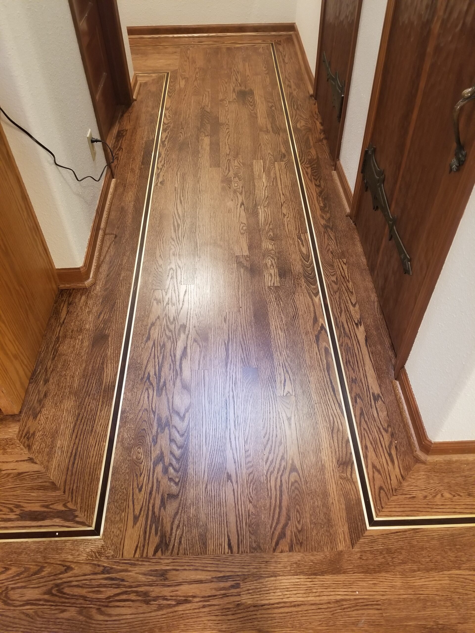 Sanded, prepped  and custom stain with gunsmoke royal mahogany with water-based semi-gloss finish to Los Altos hallways and bedrooms. Different view.